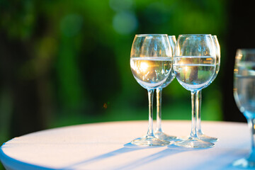 Champagne glasses on the buffet table. Table setting for a buffet at a party. 