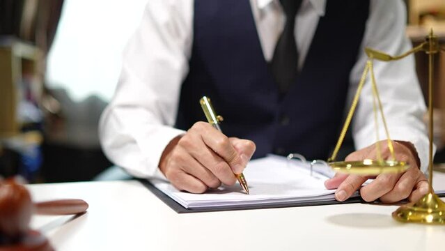 Partner lawyers or attorneys discussing a contract agreement. Successful businessmen have a contract in place to protect it,signing of modest agreements form in office...