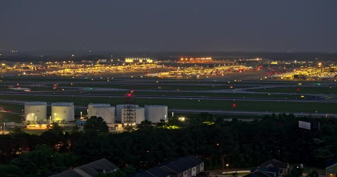 Atlanta Georgia Aerial v892 hyperlapse capturing activities on the concourse, with planes taking off and landing on the runway at Hartsfield Airport at night - Shot with Mavic 3 Pro Cine - June 2023
