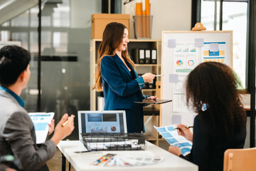 diverse team of professionals engaged in a website graphic design board meeting, sharing opinions on UX and UI design elements. Asian man, African American people, black, afro, caucasian female