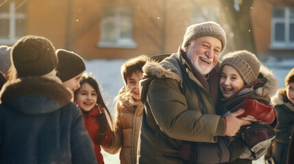 Fototapeta premium Senior grandparent picking up grandchildren after school.