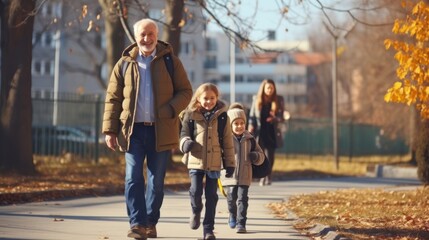 Senior grandparent picking up  grandchildren after school.