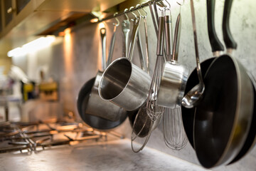 Pots and pans hanging in commercial kitchen