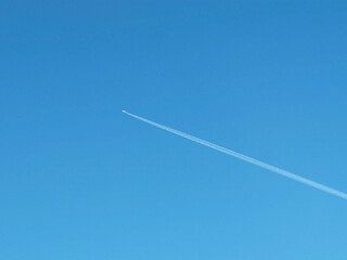 Blue sky with airplane as background