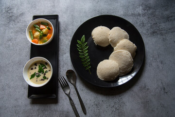 South Indian snacks idli sambar or idly sambhar prepared by steaming fermented rice and served with...