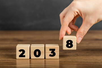 2038 on Wooden Block. Merry Christmas and Happy New Year, 2038 new year idea concept. Going in...