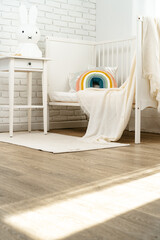 Fototapeta na wymiar Kid's room interior with comfortable bed and rainbow pillow