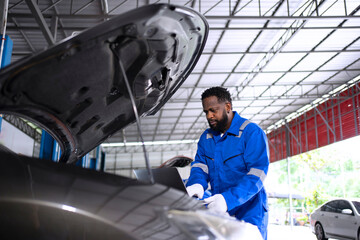 Mechanic work at auto repair shop.