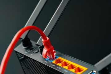 Modern router with cables plugged in close up