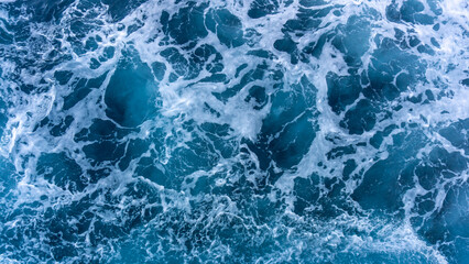 Seascape from high perspective. Top view of ocean sea water splashing.