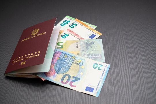 Top shot of Colombian passport with euro bills