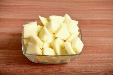 Melon is cut into pieces.soft melon on the table, sweet watermelon, cut into large chunks.space for text.table decoration.The concept of the dish.close-up
