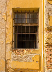 A window in a derelict historic building in the centre of Karlovac, central Croatia