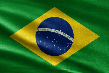 Brazil flag waving in the wind. Close up of Brasil banner blowing, soft and smooth silk. Cloth fabric texture ensign background. Use it for national day and country occasions concept.