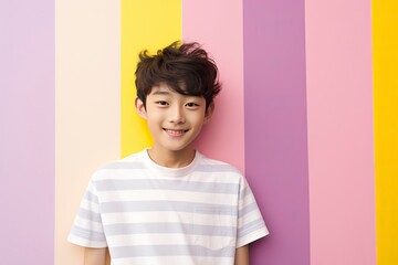 Korean Boy Against a Striped Color Background.