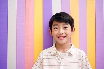 Korean Boy Against a Striped Color Background.