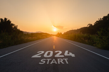 Happy new year 2024,2024 symbolizes the start of the new year. The letter start new year 2024 on the road in the nature route roadway sunset tree environment ecology or greenery wallpaper concept. - obrazy, fototapety, plakaty