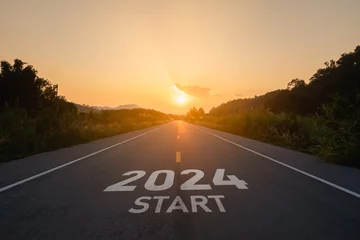 Foto op Canvas Happy new year 2024,2024 symbolizes the start of the new year. The letter start new year 2024 on the road in the nature route roadway sunset tree environment ecology or greenery wallpaper concept. © Woraphon