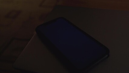 Woman hand using is sliding to turn off the mobile phone to reduce power consumption