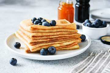 Thin crepe pancakes for breakfast with berries