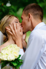 Portrait of a couple kissing in love. Happy newlyweds. 