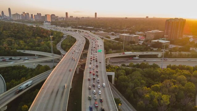 Aerial Drone Hyperlapse Fly Above Big Urban Highway Intersection in Houston USA Interstate i10 and i610 Freeway during Daylight. Rush Hour I45 and I610 intersection.