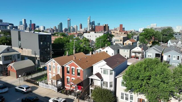 Neighborhood suburb of Chicago. Aerial shot of houses and homes with Chicago skyline on summer day.