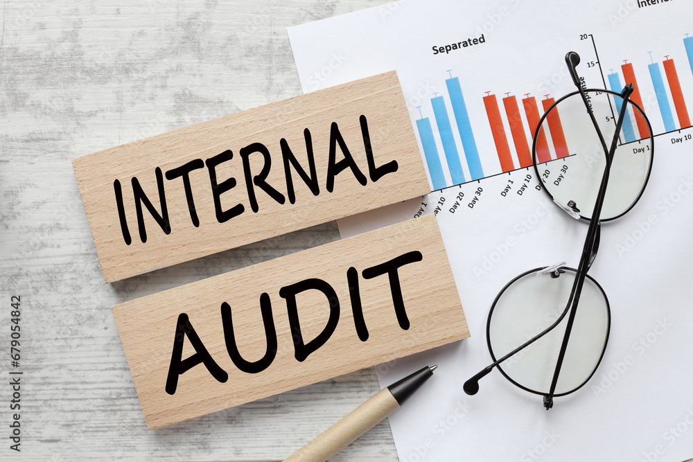 Aufkleber internal audit paperwork documentation with pen, data and charts. business improvement and quality m
