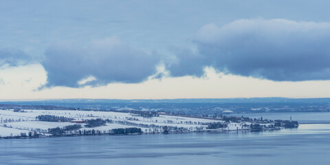 The cultural landscape of Nes and Ringsaker by Lake Mjosa in early winter.