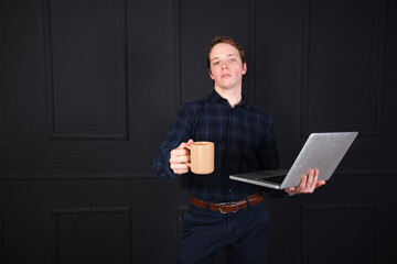 Handsome young man posing in the studio. Study and work.