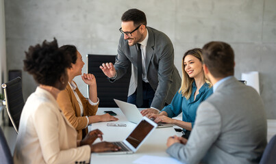 Fototapeta premium Successful business professionals presenting analytical report, working together in corporate office