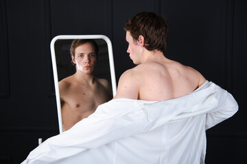 Handsome young man posing in the studio. Study and work.