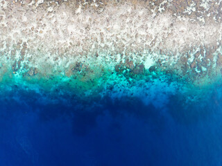 Beautiful tropical blue ocean reef aerial view top down