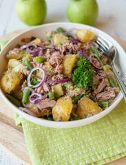 Healthy potato salad with tuna, onions, green beans. Italian food