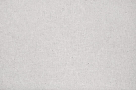 Soft plain linen fabric texture background in neutral earthy oat beige color