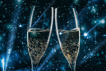 two glasses of champagne in the spotlight - new year celebration
