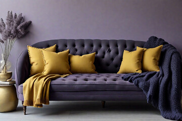 Navy blue settee paired with mustard-yellow tufted cushions and a charcoal knitted throw against a...