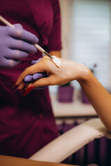 Obraz premium spa and treatment skin hand, Woman applying organic moisturizing hand cream, hand skin care concept, winter, female skin protection, beautiful woman skin care with hand cream, lotion on hands