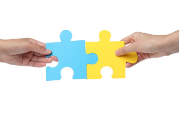 PNG, Blue and yellow puzzles in hands, isolated on white background