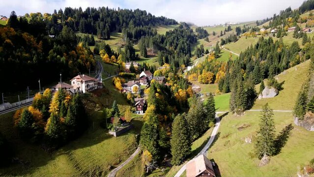 Panoramic Aerial View of the Famous Funicular Station at Rigi Kl&ouml;sterli on Rigi Mountain in the Swiss Alps Showcasing a Picturesque Alpine Village