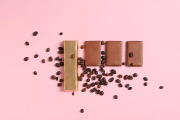  Chocolate bars with coffee beans on a pink background © Atlas
