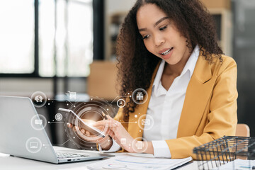 Businesswoman working with tablet and using a calculator to calculate the numbers of static in...