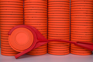 clay target thrower with orange clay targets