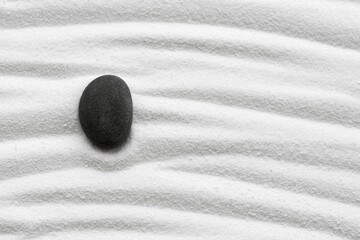 Zen Garden with Grey Stone on White Sand Line Texture Background, Top View Black Rock Sea Stone on Sand Wave Parallel Lines Pattern in Japanese Garden, Simplicity Day, Meditation,Zen like concept..