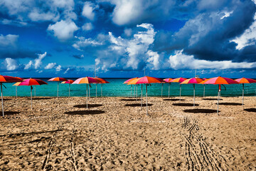 umbrellas on the beach with sky - 679084023