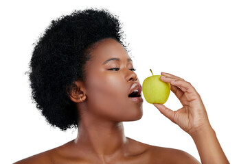 Happy black woman, eating and apple for diet, natural nutrition or health isolated on png...