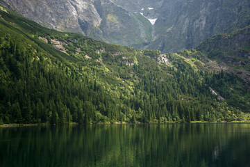Beautiful clean lake in the Polish mountains in summer, mountain landscape. Popular Morskie Oko lake in Zakopane, Poland.