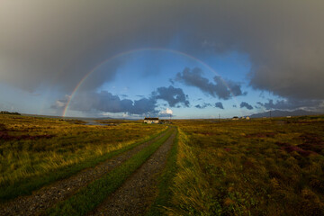 Scottish Ilands double rainbow over house