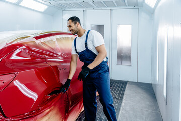 Automotive paint services, quality auto body shop concept. Arabian repairer car painter repairman...