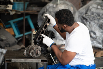 Men repairing car engine in auto repair shop, Selective focus.